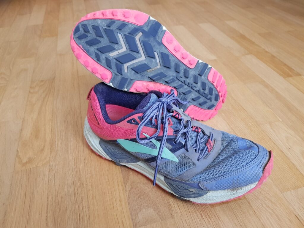 Old and worn-out trail running shoes Brooks Cascadia
