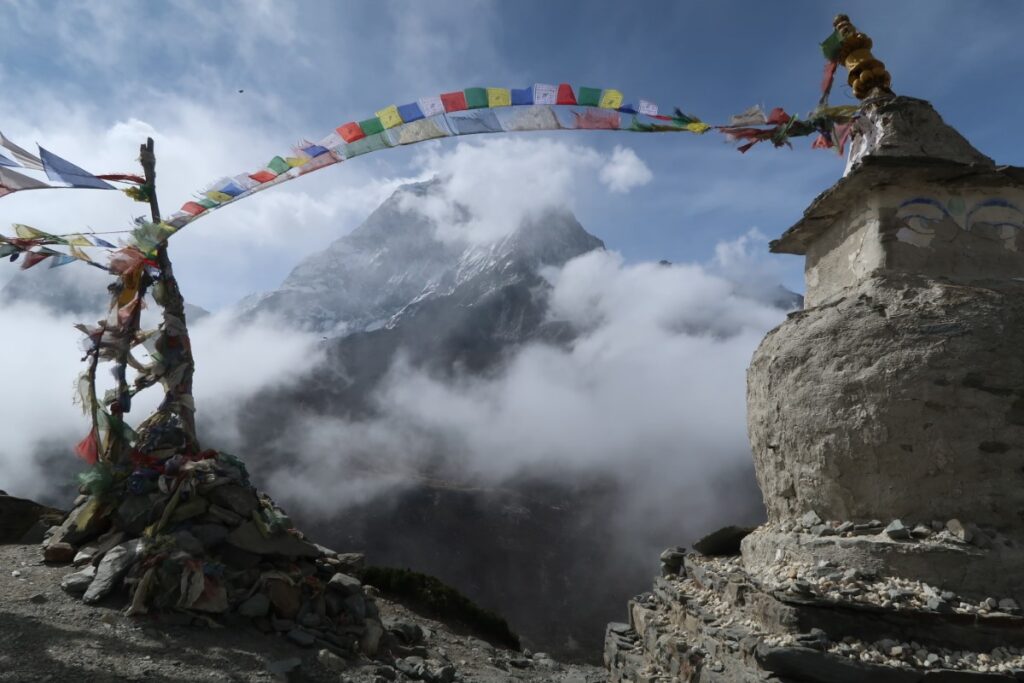 Prayer flags and stupa in front of Ama Dablam in Himalaya Nepal