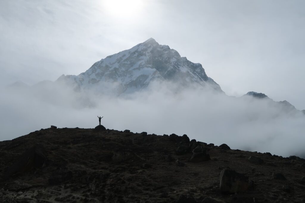 Person in front of mountain in Himalaya Nepal